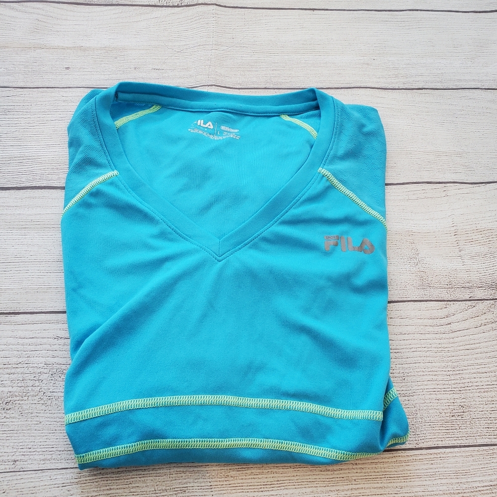 Fila Women's running short sleeve shirt. Size large. Teal blue .